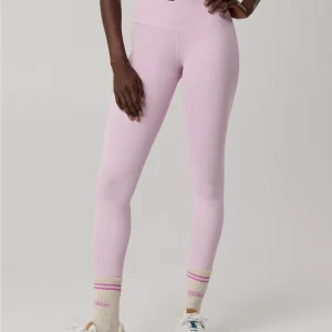 Pink high-waisted crossover leggings with ankle stripes