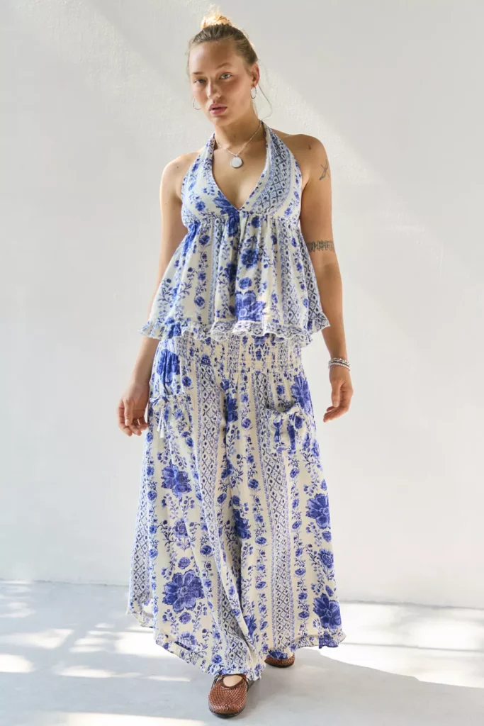 Woman wearing blue floral babydoll tank top with matching wide-leg pants