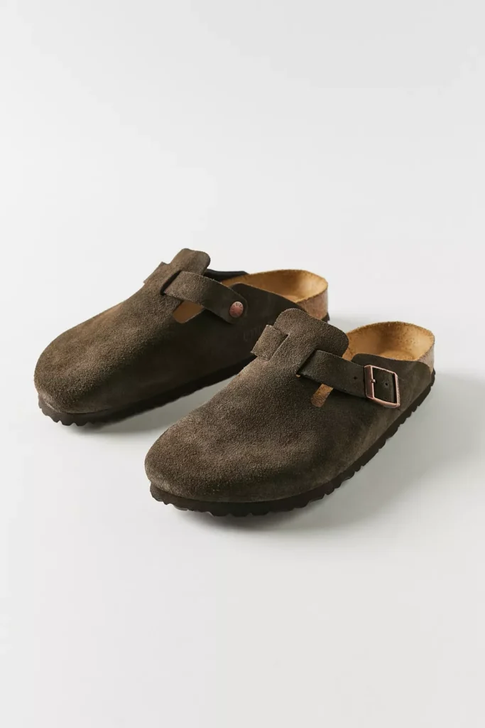 Pair of brown suede Birkenstock Boston clogs with adjustable buckle